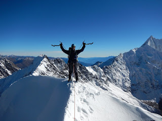 Man on Summit of Mountain