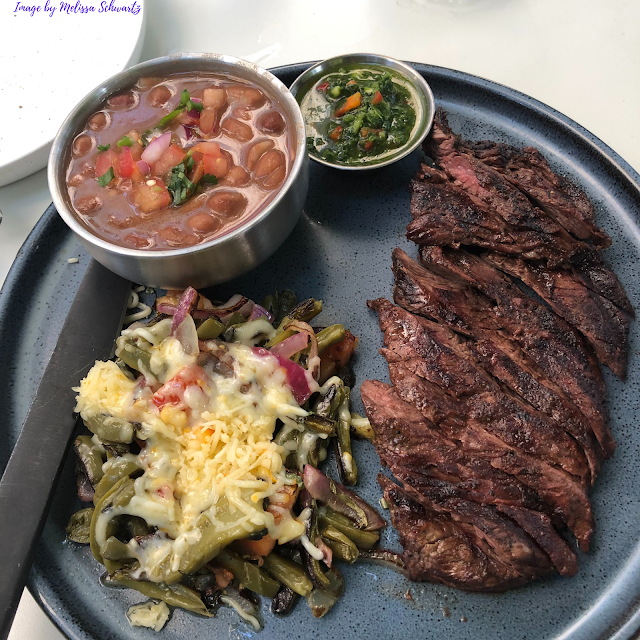 Carne Asada delivered to the table in an artful presentation.