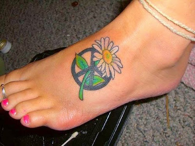 Awesome peace sign with a daisey on foot tattoo