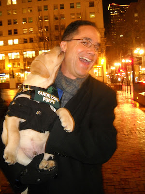 Guide Dog Puppy Zaffino gives KGW-TV Weatherman Matt Zaffino a kiss on the cheek