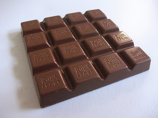 A christmas edition of Ritter Sport containing an orange and caramel flavour cream filling