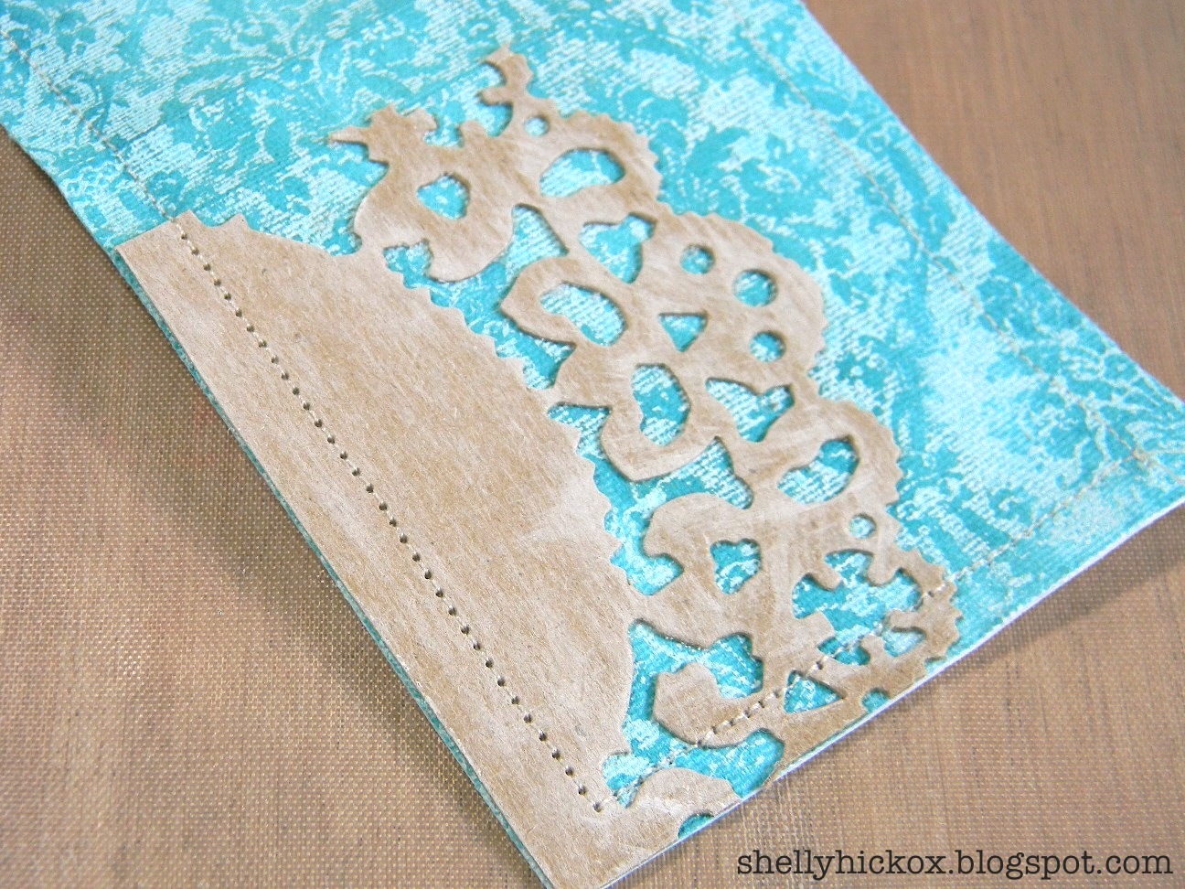 Using the Sizzix Distressed Doily die, die-cut a piece from chipboard ...