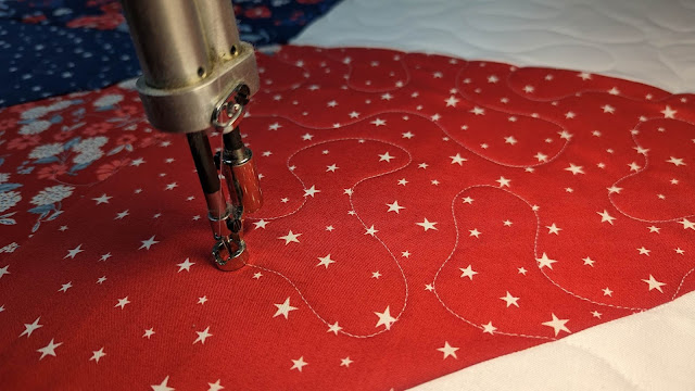 Meander quilting on a longarm