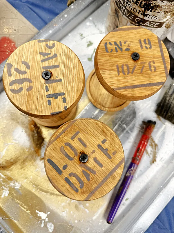 stenciled crate stencil on spool tops