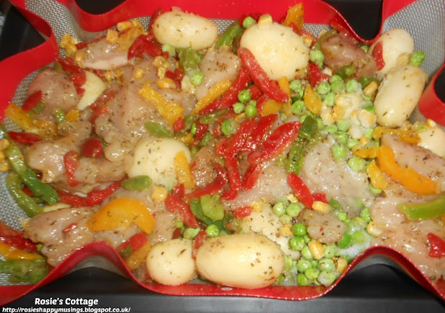 Easiest Ever, Use What You Have, Garlic Chicken Tray Bake: I started with some diced chicken, then added sliced mixed peppers.  I then drizzled over lots of lovely olive oil and sprinkled over ground garlic and Italian herbs from the spice rail.  To this I added tiny potatoes...