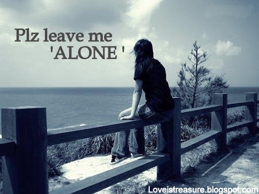 sad girl sitting alone near beach