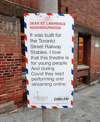 Poster affixed to a pole. Has the red and blue edging seen on Air Mail envelopes. Contains a message about how wonderful Young People's Theatre is and a bit about the history of the building it resides in.