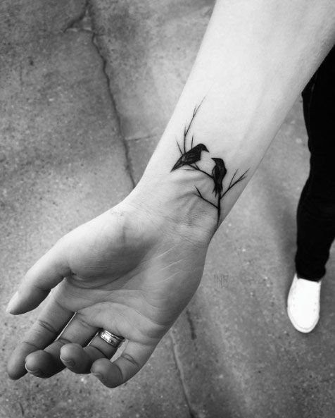 Attractive tattoo design on women Wrist Bird Tattoo 