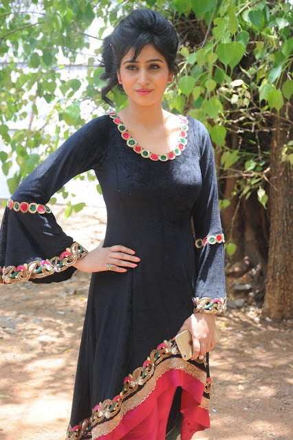 Varshini Sounderajan looking chic in a black outfit, a picture of elegance.