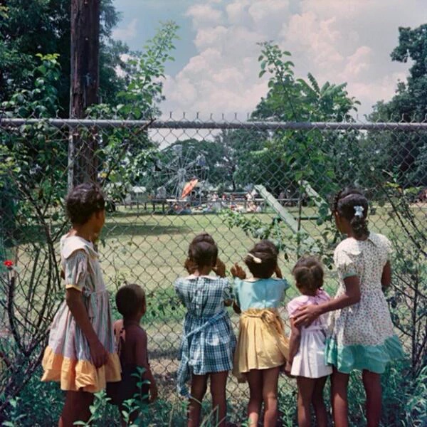 36 Amazing Historical Pictures. #9 Is Unbelievable - Black children watching as white children play in a whites only park (1956)