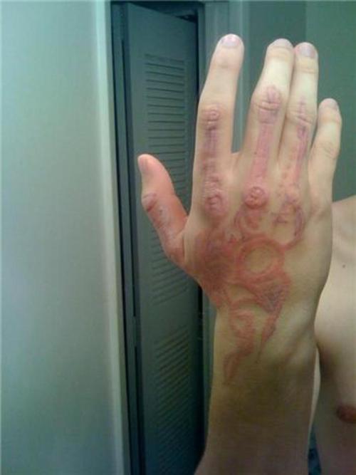 Tribal Hand Tattoo w pic of uv tattoo healing at 922 PM