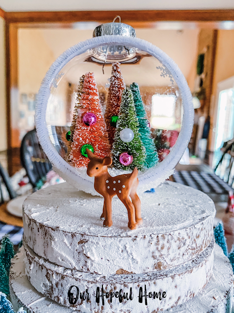 snow globe Christmas ornament filled with bottle brush trees mini deer