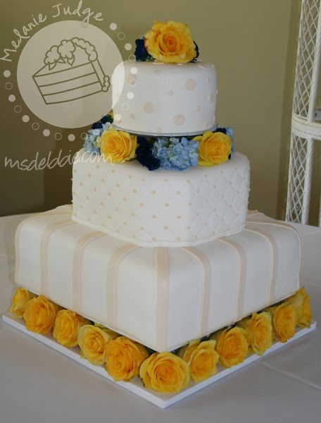 yellow flowers wedding cake. According to the cake design,