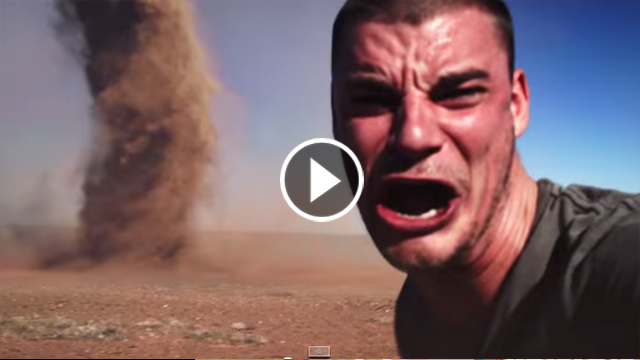 Man films himself ‘running into the path of a TORNADO in the Australian Outback’.