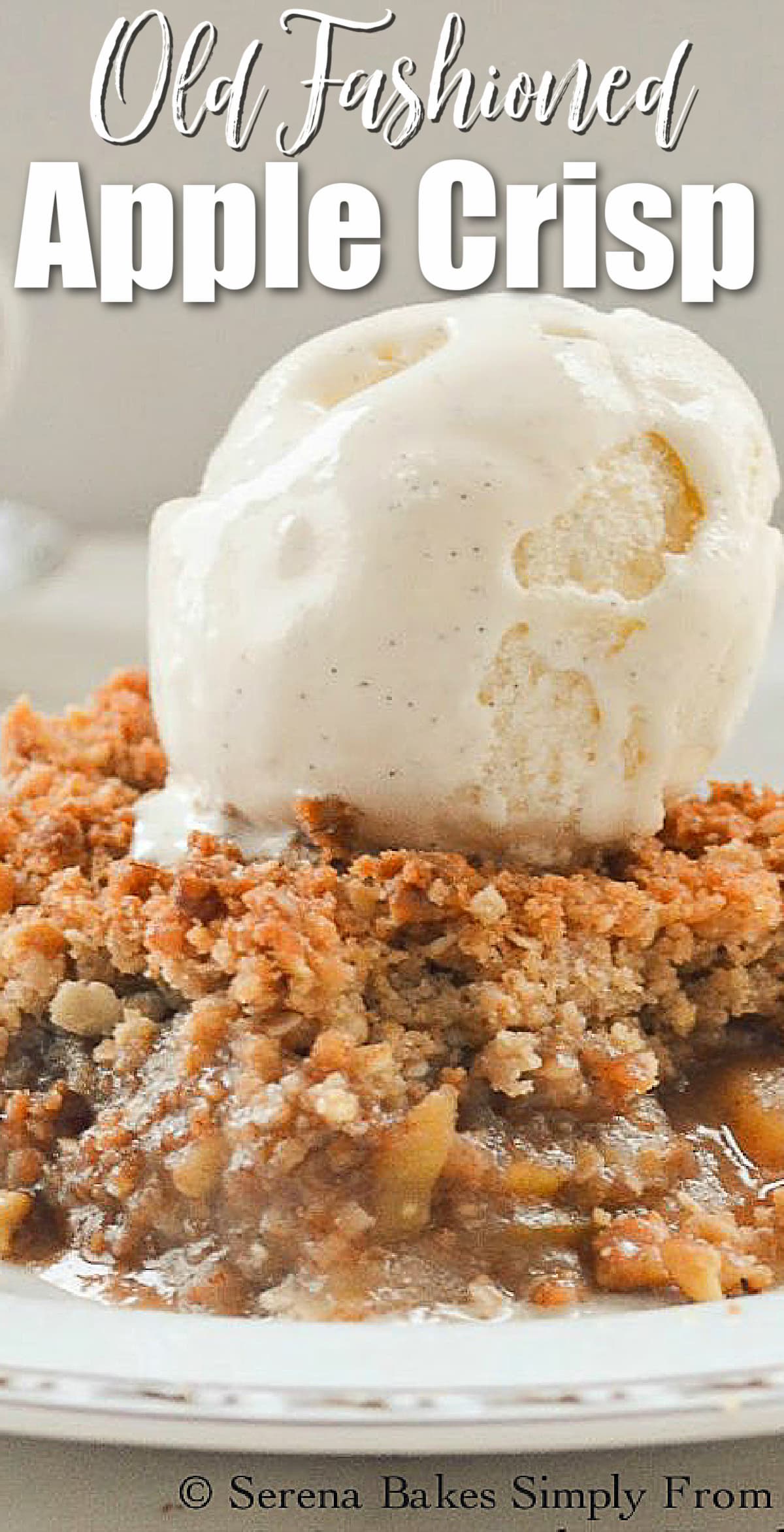 A side shot of Apple Crisp top with ice cream on a white plate with white text at the top Old Fashioned Apple Crisp.