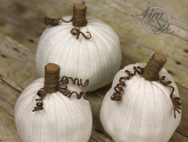 Three little white sweater pumpkins