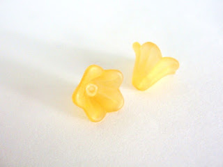 http://www.beads2string.com/collections/flower-leaf-acrylic/products/orange-acrylic-beads-15x10mm-flower