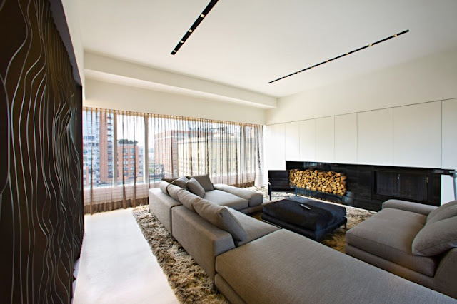 Photo of black curvy wall in the living room of one of the modern New York penthouses