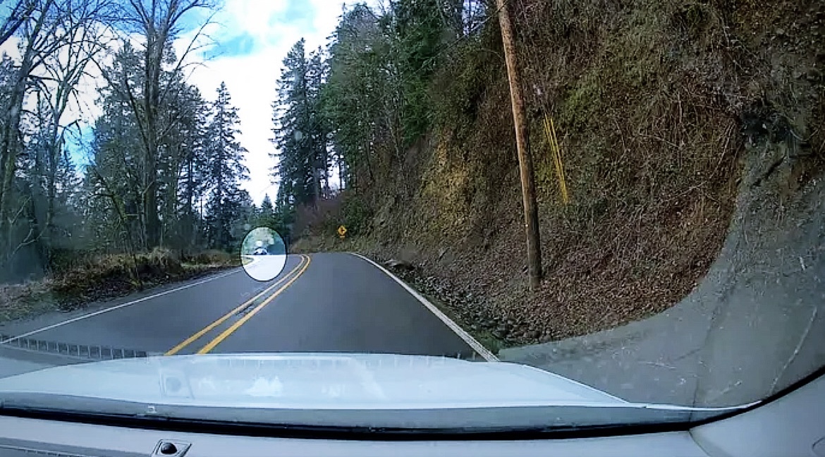 The car is seen going airborne after leaving the winding Oregon road.  (Oregon State Police Facebook)