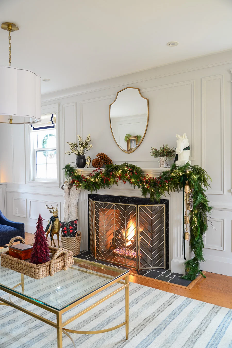 traditional christmas mantel decor with faux garland, mirror, berry vine garland