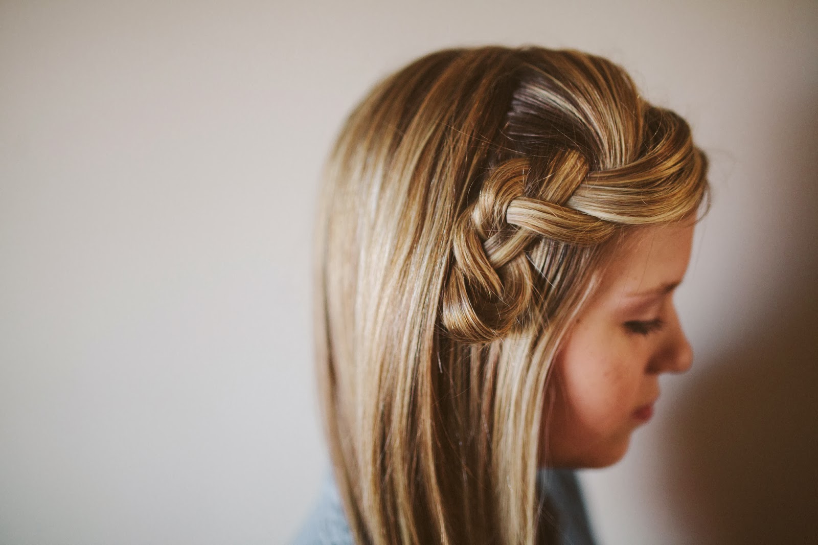 ... hair tie and hide it behind another section of hair with bobby pins