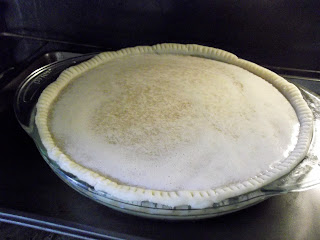 pie filling poured into homemade pie crust