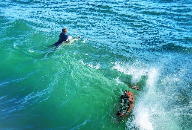 Surfing is a surface water sport in which a surfer rides on the forward or deep face of a moving wave, which usually carries the surfer towards the shore. Waves suitable for surfing are primarily found in the ocean, but can also be found in lakes or rivers in the form of a standing wave or tidal bore. However, surfers can also utilize artificial waves such as those from boat wakes and the waves created in artificial wave pools.