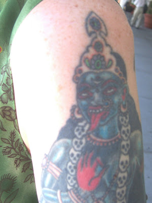 This tattoo is a traditional image of Kali, with one significant exception.