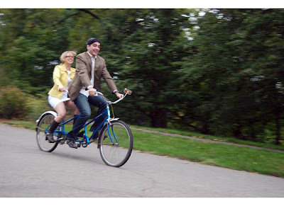 romantic couple on a tandem bicycle
