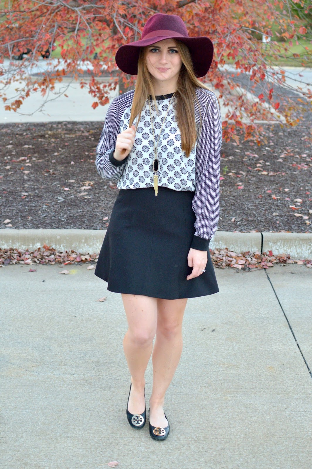printed black and white top with a black skirt