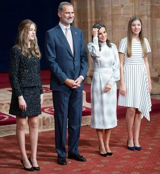 Queen Letizia in Cherubina dress. Infanta Sofia in Hugo Boss Kesha dress. Princess Leonor in Carolina Herrera tweed jacket and skirt