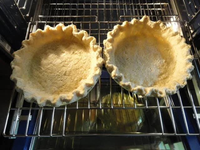 Remove foil finish baking pie shell.