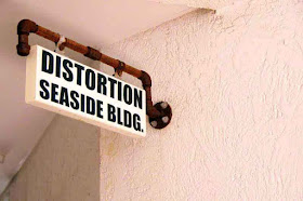 Distortion Seaside Building Sign