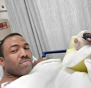 Cedric McMillan clicking selfie while in the hospital