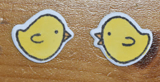 Stamp two chicks onto white card, colour in and die cut out