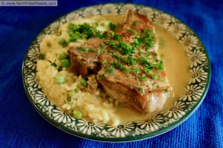 a plate of Instant Pot Dijon Pork chop with Instant Pot Spring Risotto