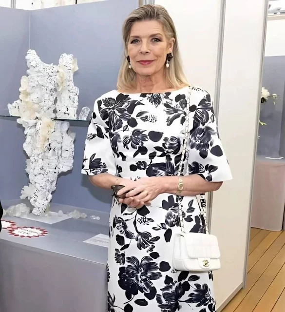 Princess Caroline wore a Kora floral-print faille maxi dress by Emilia Wicksead. Pearl earrings and Chanel white leather bag