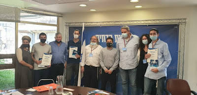 Top three winners of the competition with members of the Religious Zionist party