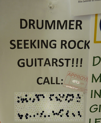 Poster Text: Drummer Seeks Rock Guitarst