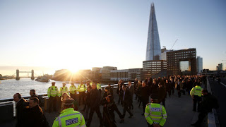 London residents walk by the site of a 2019 terrorist attack.HENRY NICHOLLS / REUTERS