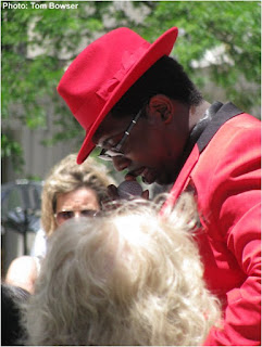 Theo Huff interacting with women in the crowd at the 2016 Chicago Blues Festival Preview event at Chicago's Daley Plaza | Photograph by Tom Bowser