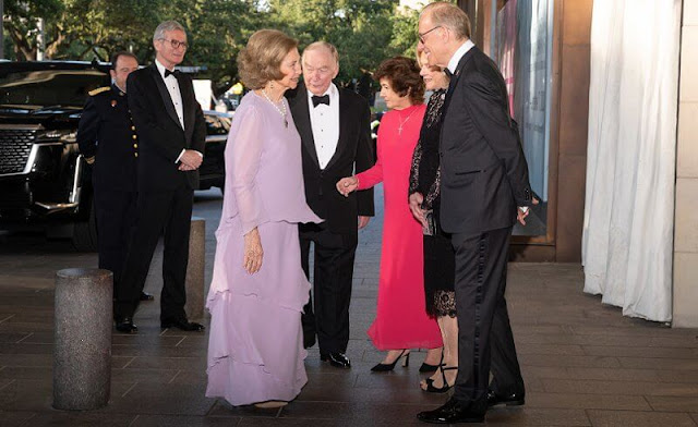 Queen Sofia wore a rose pink lilac silk cape gown, and pearls and silver necklace. singer Gloria Estefan and producer Emilio Estefan