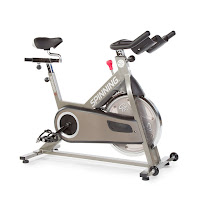 Spinner S7 Indoor Cycling Bike, spin bike with 35 lb flywheel, friction resistance, push down brake, dual sided pedals with narrow Q factor, 4-way adjustable saddle, large commercial sized handlebars