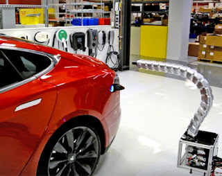 Robotic snake charging arm at Tesla