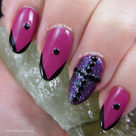 Gothic black and fuchsia nail art.