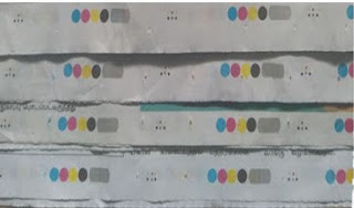 COLOURED DOTS IN THE NEWSPAPER