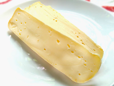 Sliced boucheron cheese.