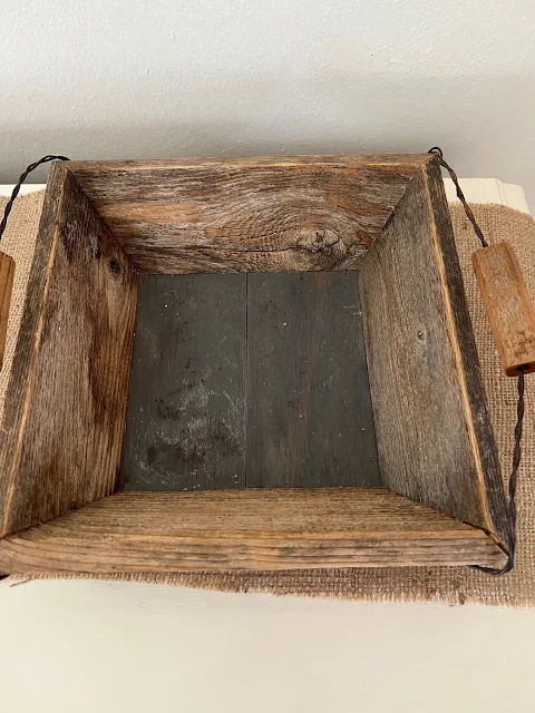 Photo of a barn wood basket tray.