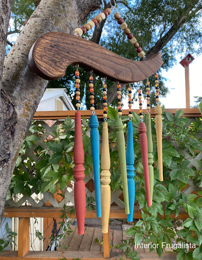 How to repurpose salvaged spindles and an arm from an old wooden chair into rustic outdoor chair spindle wind chimes that cost very little to make.