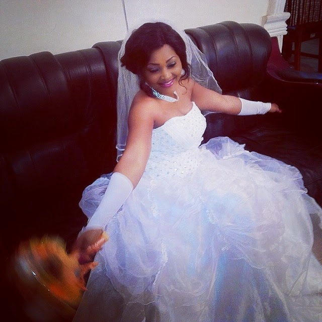 Mercy Aigbe in a wedding gown 